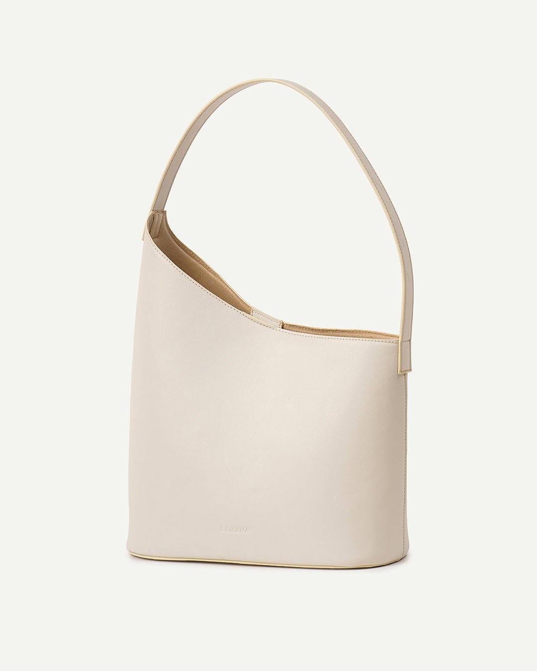 White hobo shoulder bag with curved top handles and tan trim.