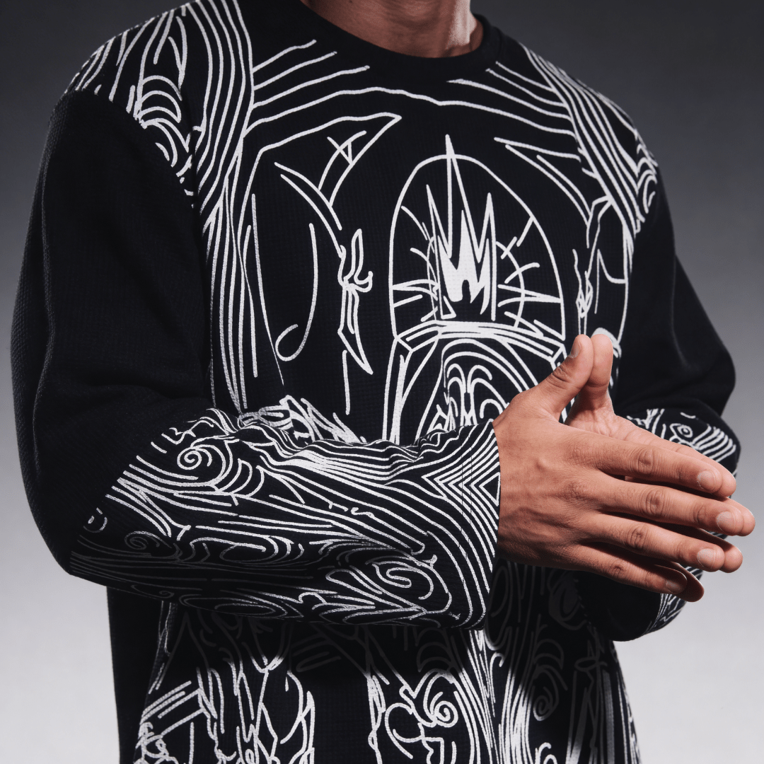 Black waffle-knit long-sleeve shirt with white fantasy line-art graphic, front view