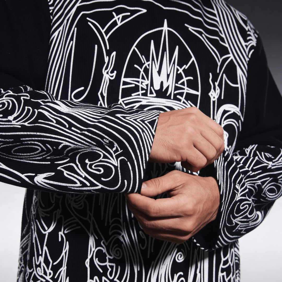 Black waffle-knit long-sleeve shirt with white back emblem and swirling sleeve design