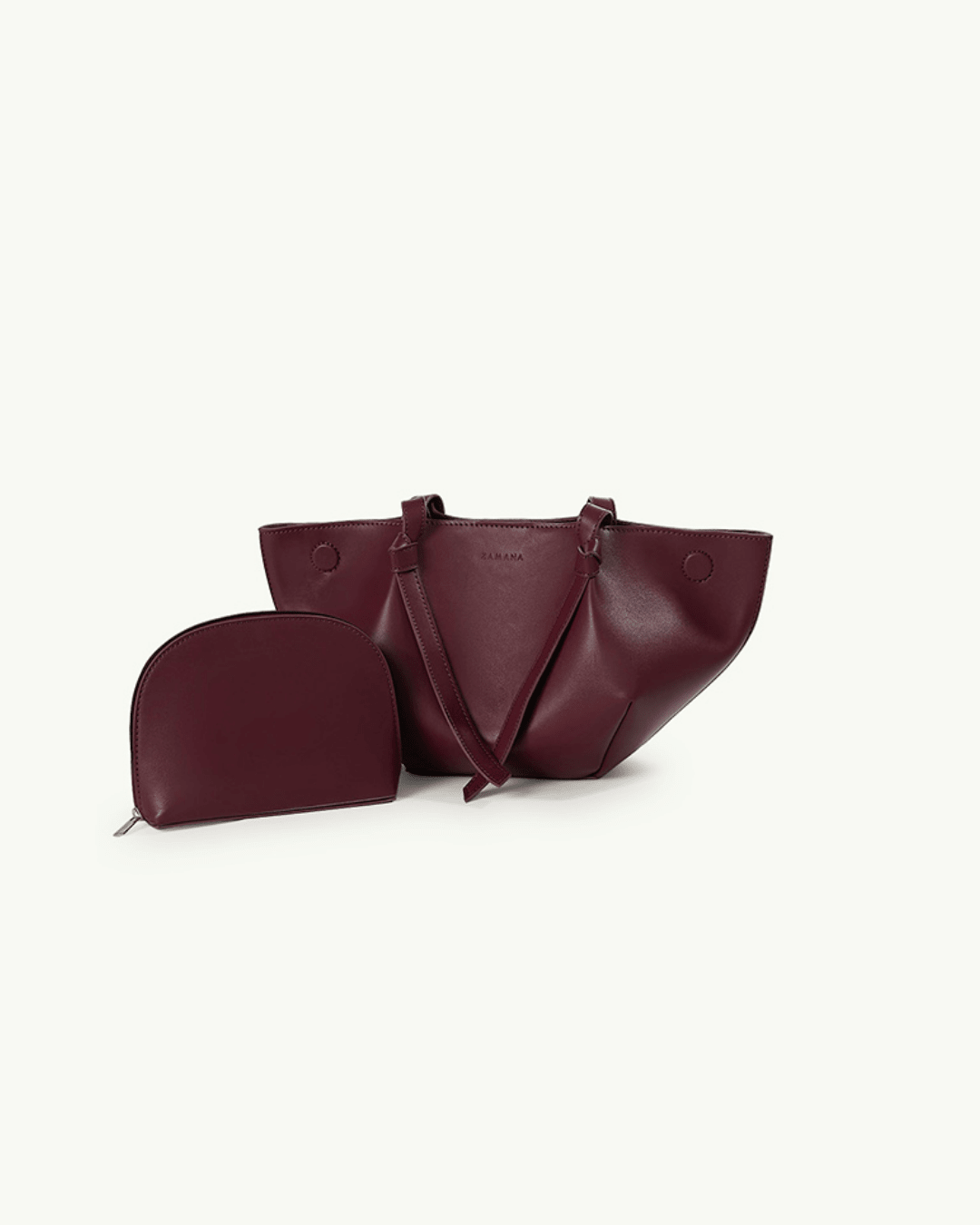 Burgundy leather tote bag with small zip pouch, flat lay