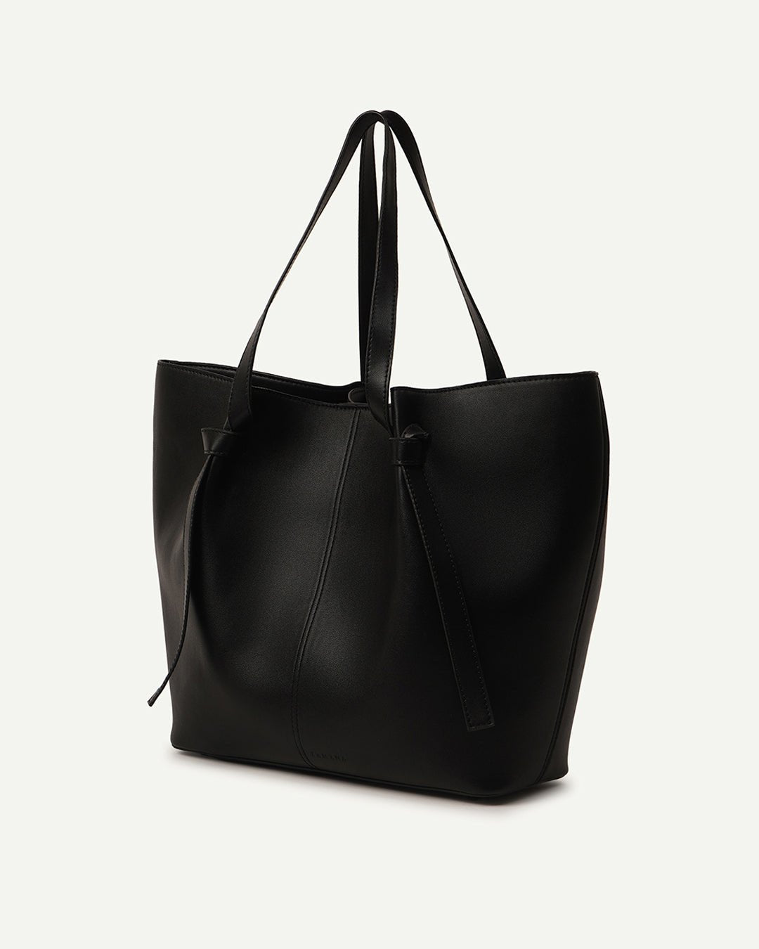 Black leather tote bag with tall straps and gathered top seam