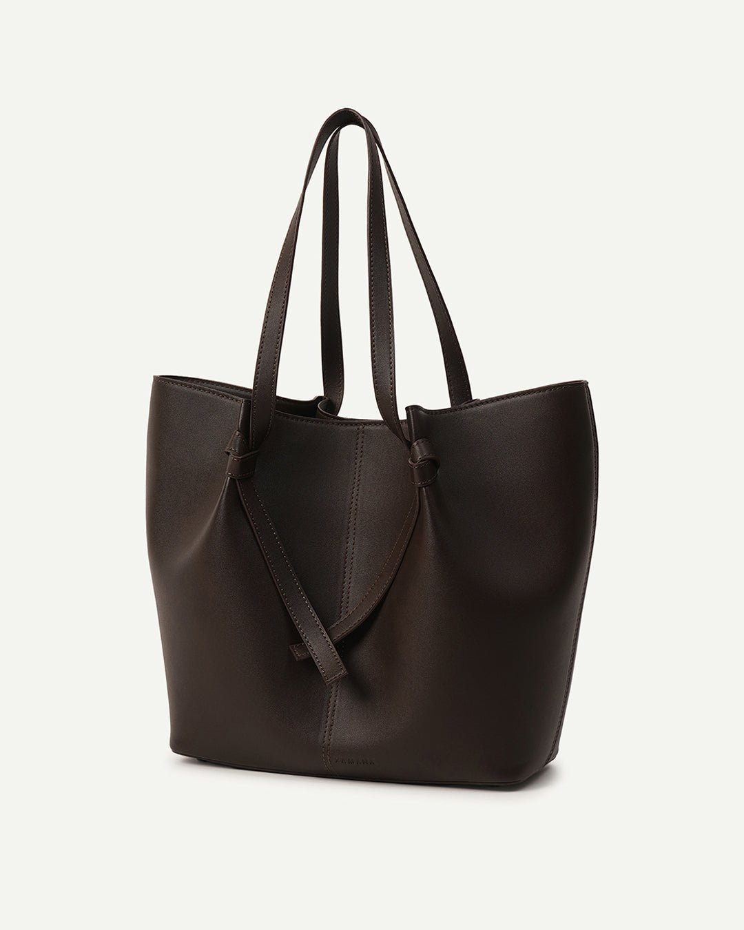 Dark brown tote bag with dual handles and stitched V-shaped front.