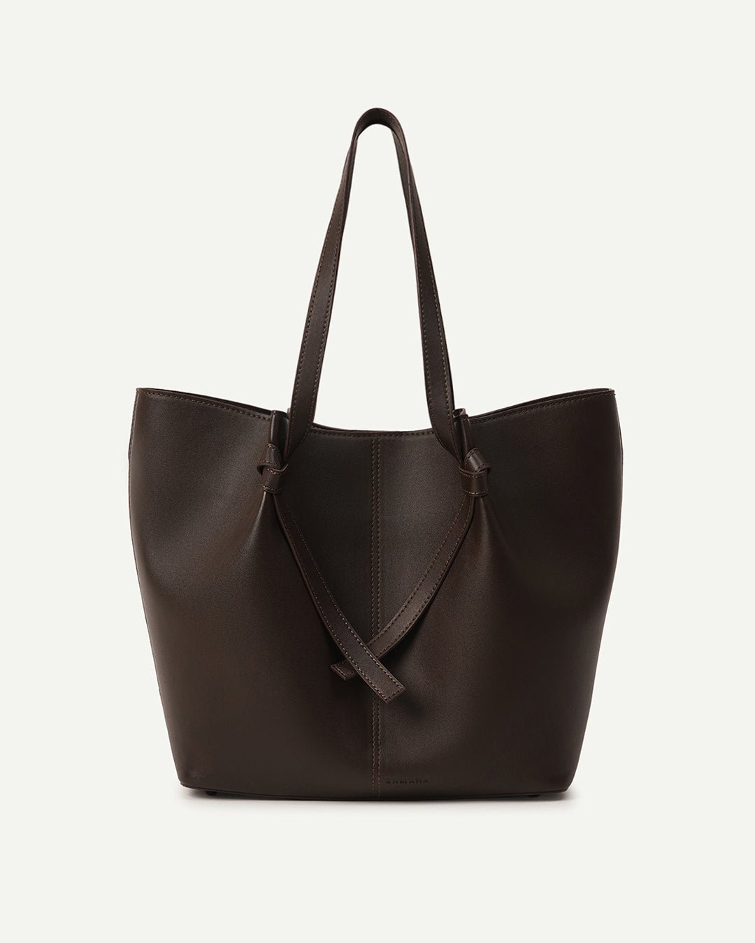 Dark brown tote bag with two top handles and V-shaped front strap detail.