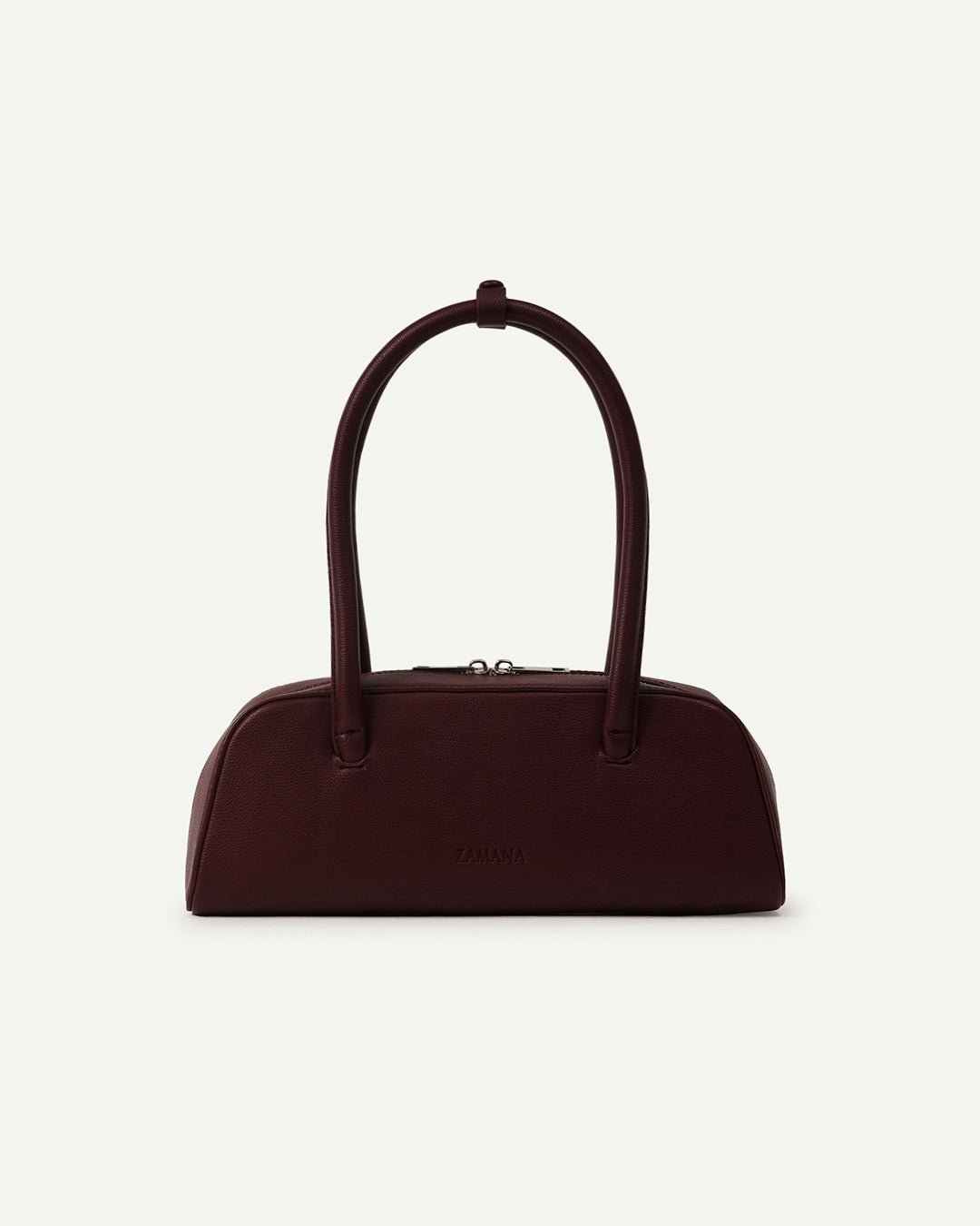 Burgundy mini satchel handbag with two top handles and curved dome shape.