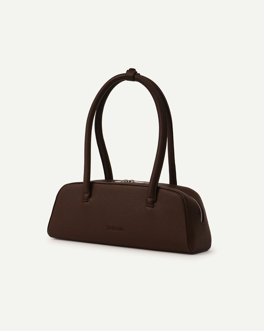 Dark brown dome-top handbag with short top handles and visible side zipper detail.
