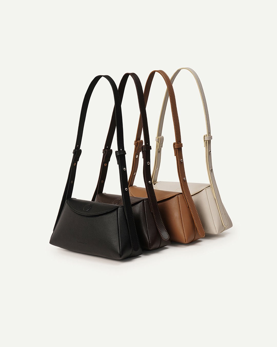 Set of mini handbags with top handles in black, tan, brown, and dark tones, rope straps.