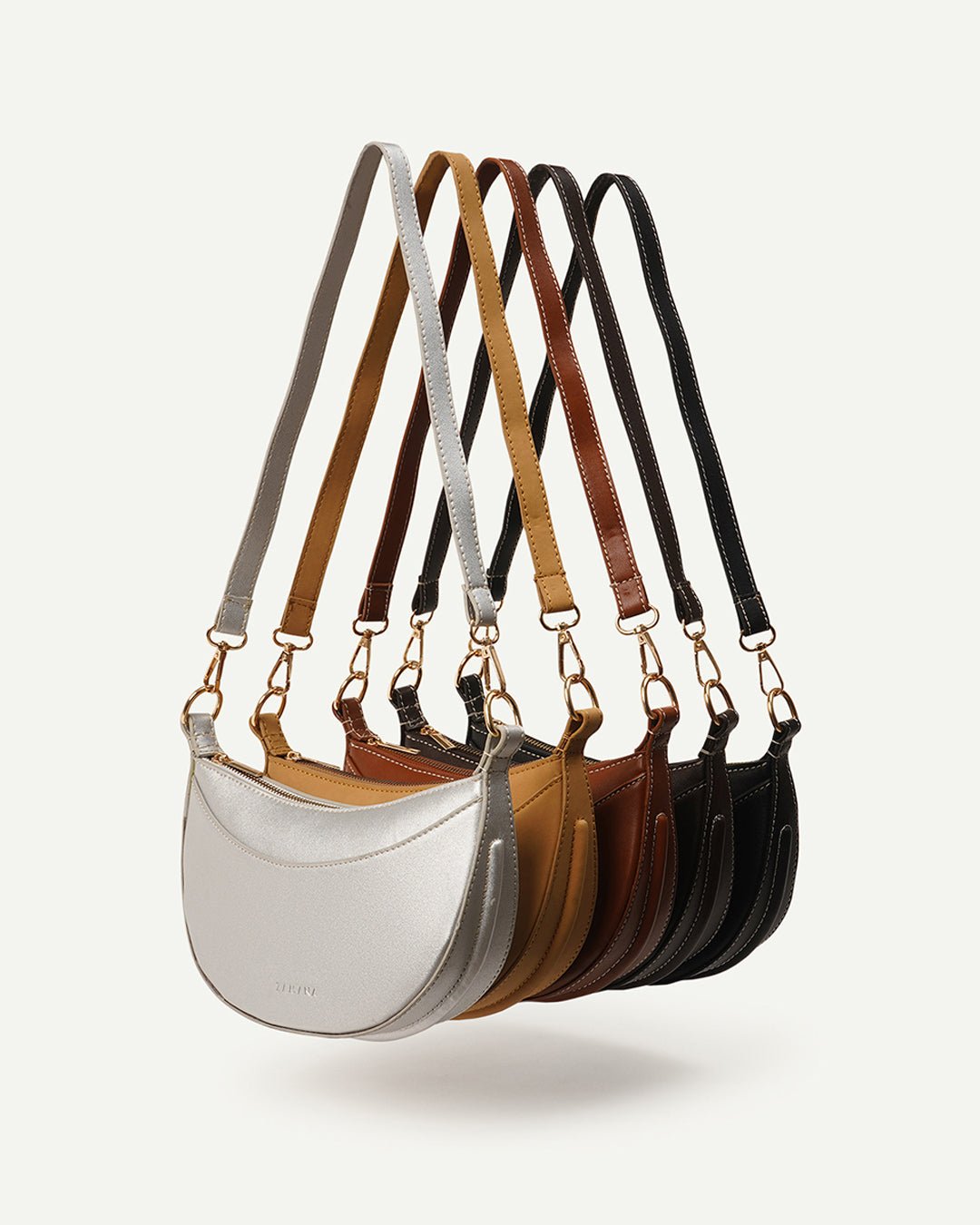 Set of crescent crossbody bags in multiple colors with adjustable shoulder straps