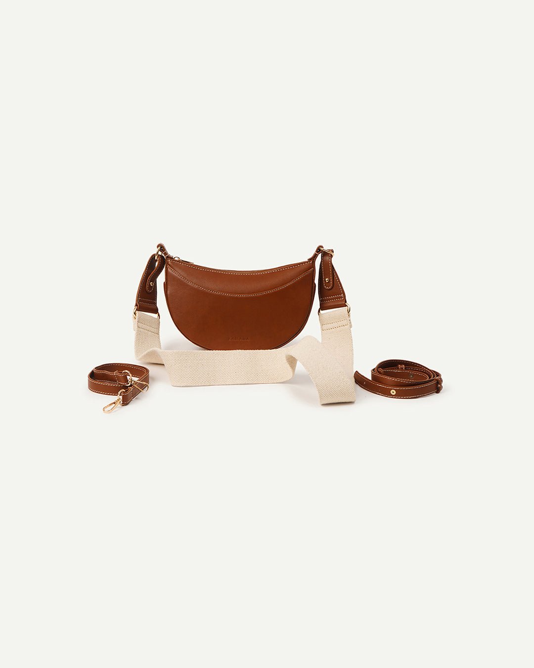 Tan half-moon crossbody bag with chain strap and matching small strap