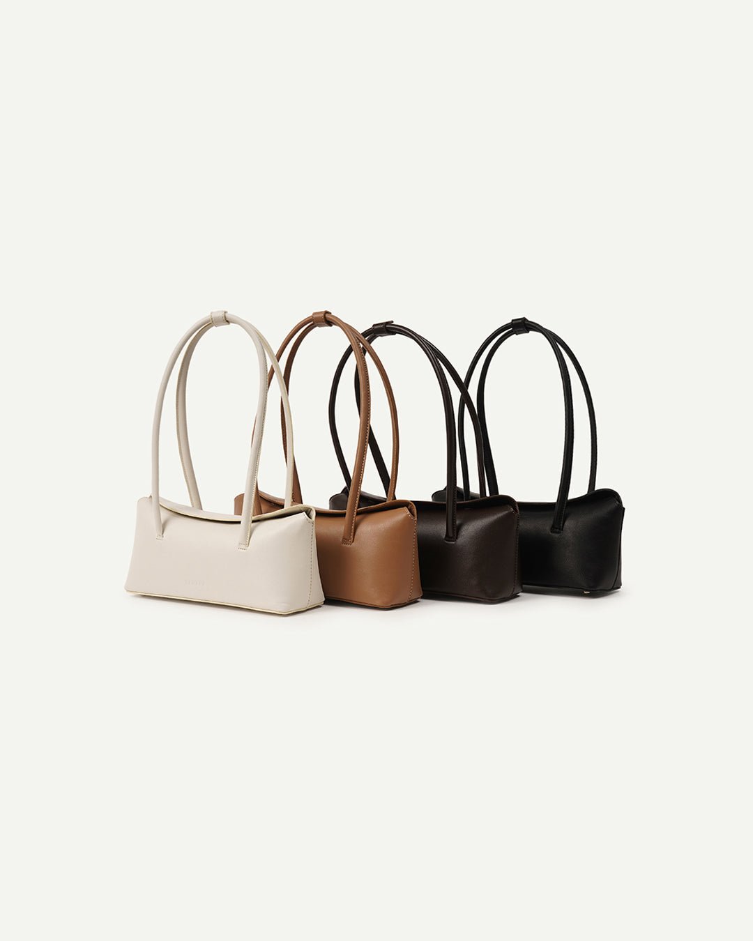 Assorted small handbags with top handles in beige, tan, brown, and black
