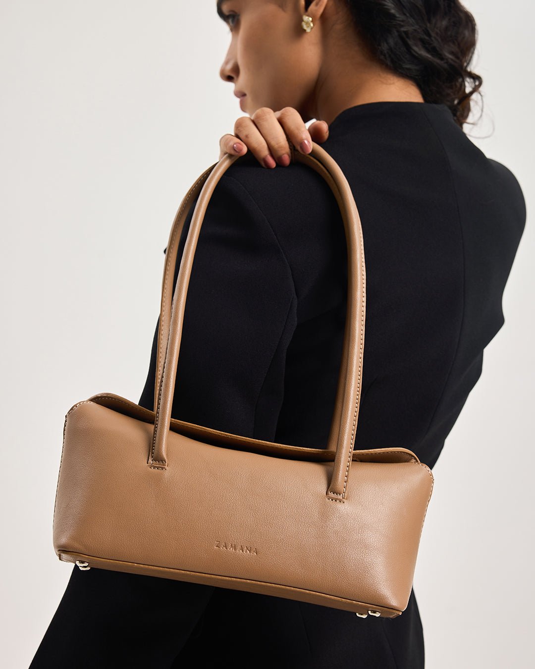 Caramel mini tote bag with top handles, front logo, side profile view