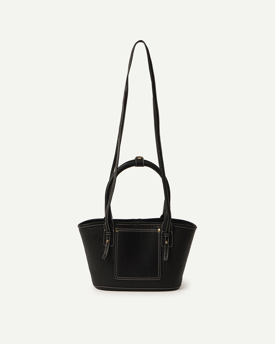 Black woven tote bag with top handles, front pocket, and gold-tone hardware