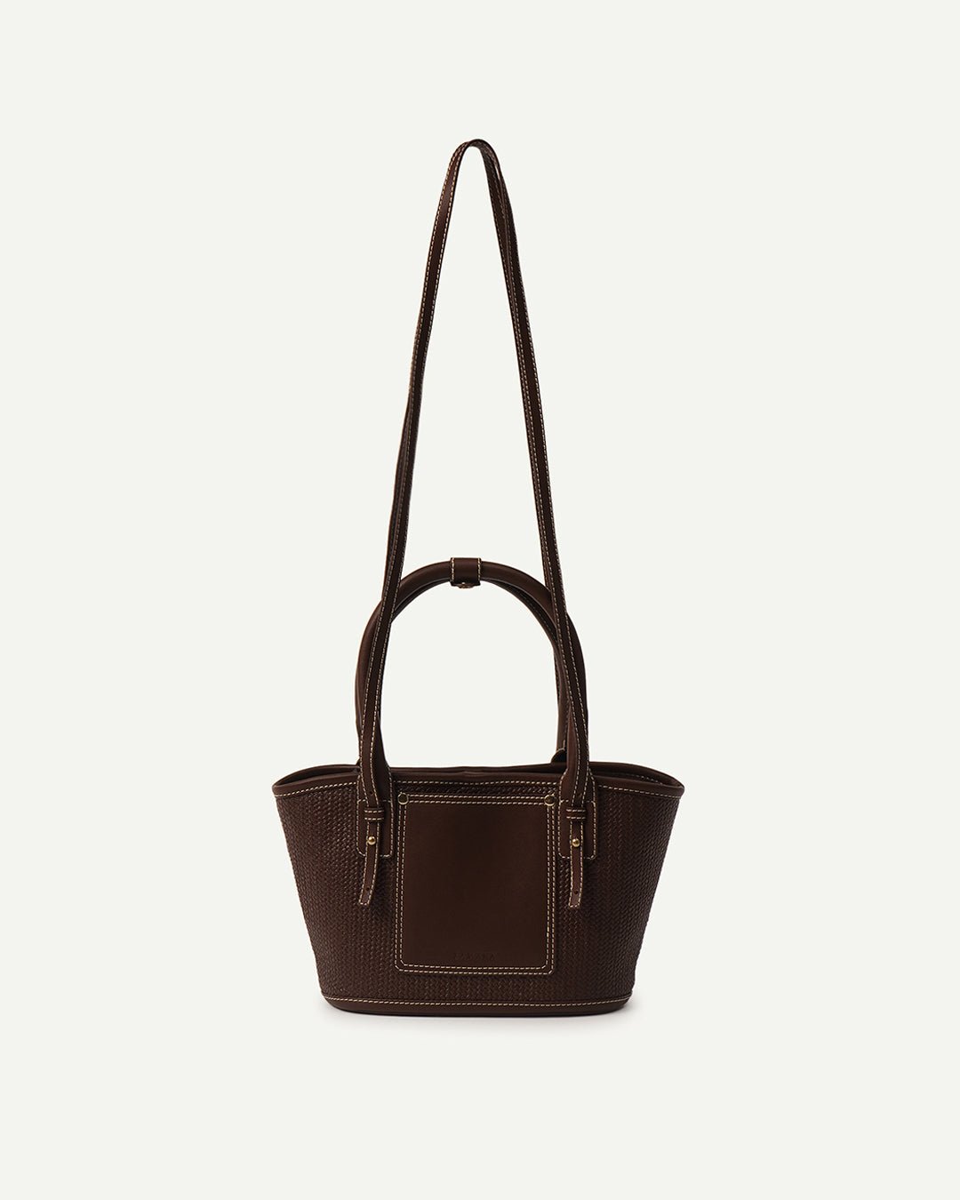 Brown woven tote bag with long top strap handles and front square pocket panel