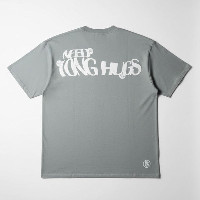 Mint green crew-neck T-shirt with large white 'LONG HUGS' print on back