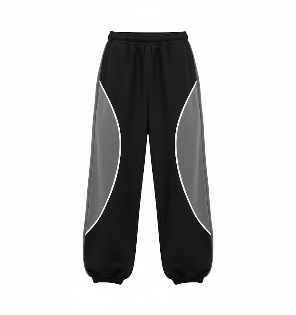 Black and gray panel baggy sweatpants with elastic waistband and wide legs