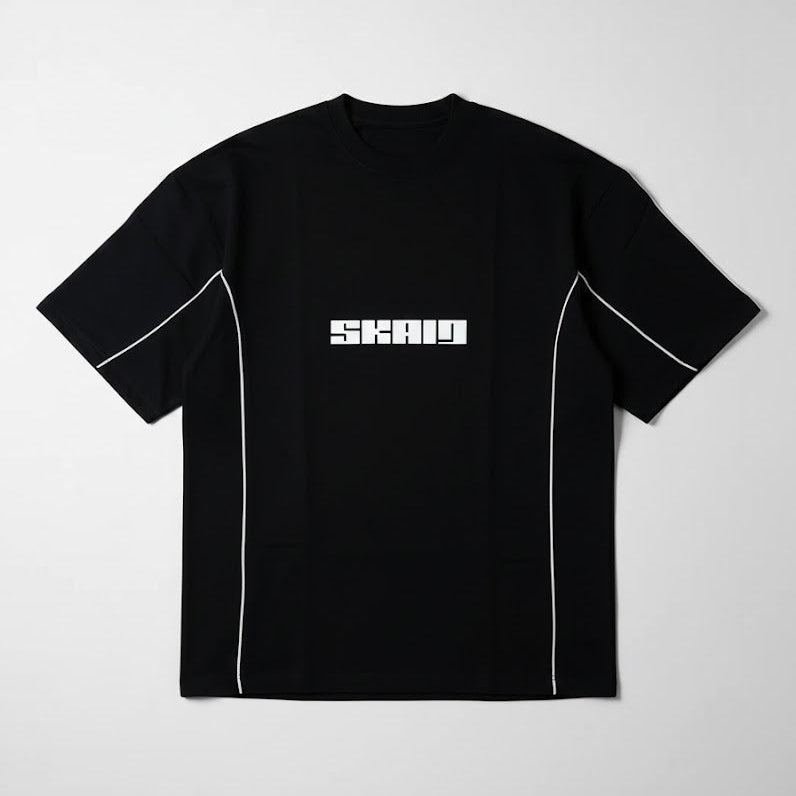 Black crewneck tee with vertical white piping and centered SKAID logo.