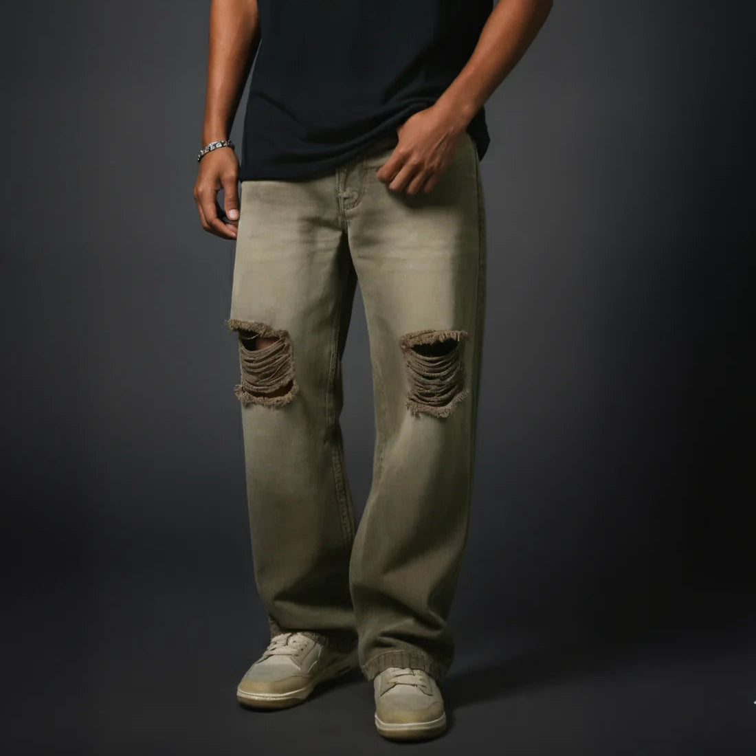 Sand-wash olive baggy denim jeans with large knee rips, relaxed straight legs.