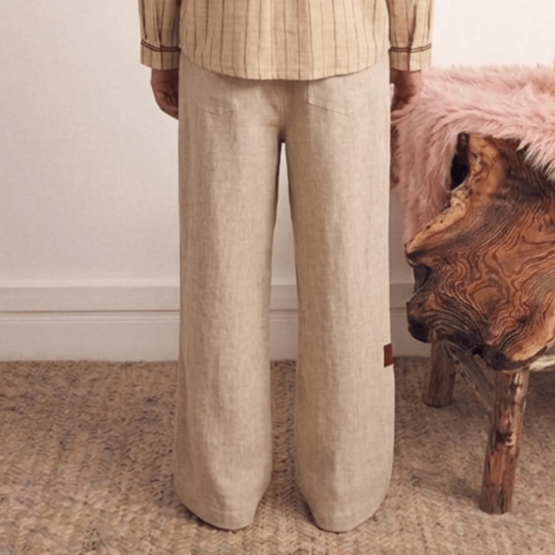 Light beige linen pants with elastic waist, wide straight legs, side pockets