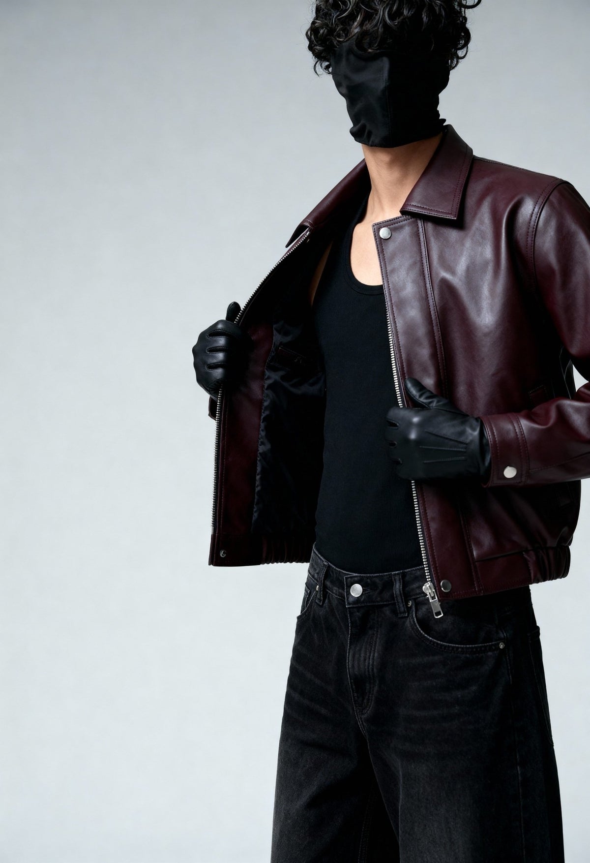 Burgundy leather bomber jacket worn open, showing stand collar and snap button front.