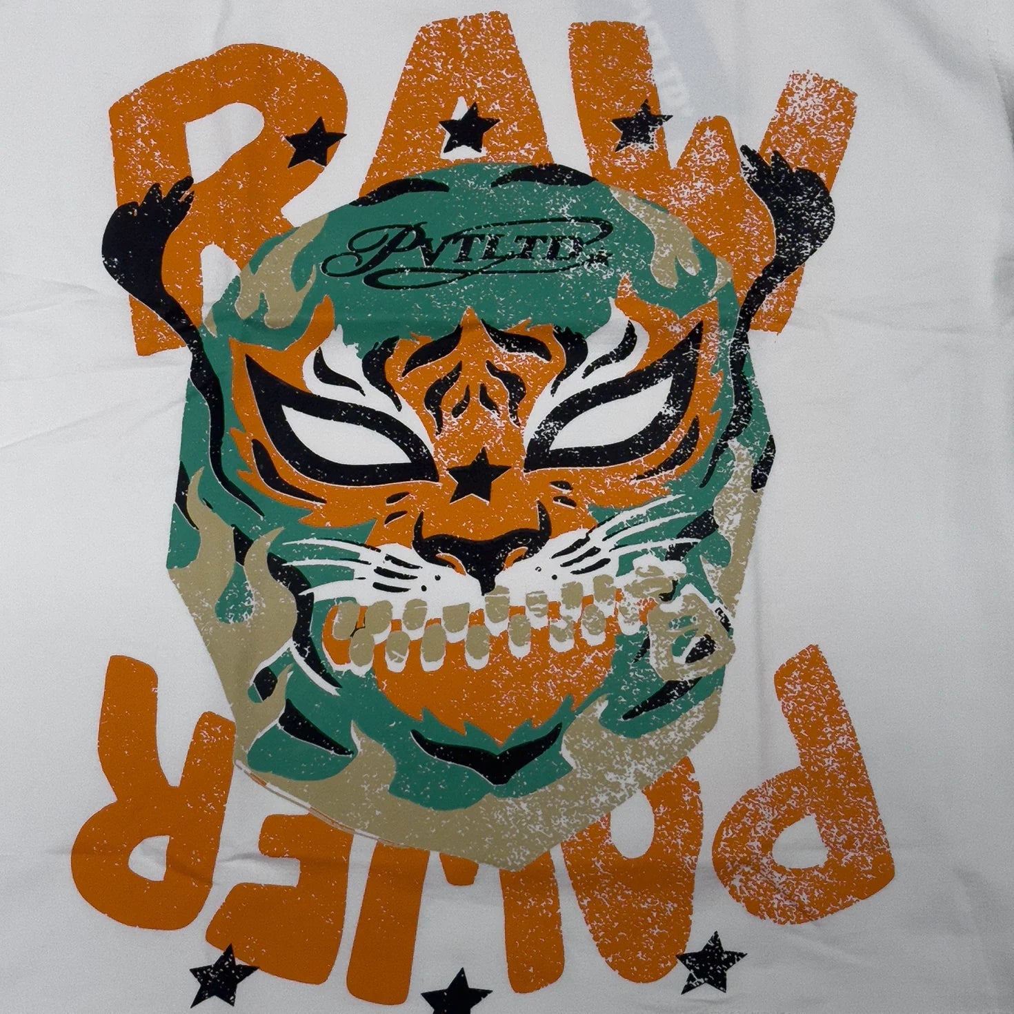 White graphic sleeveless vest with orange monster face and star accents