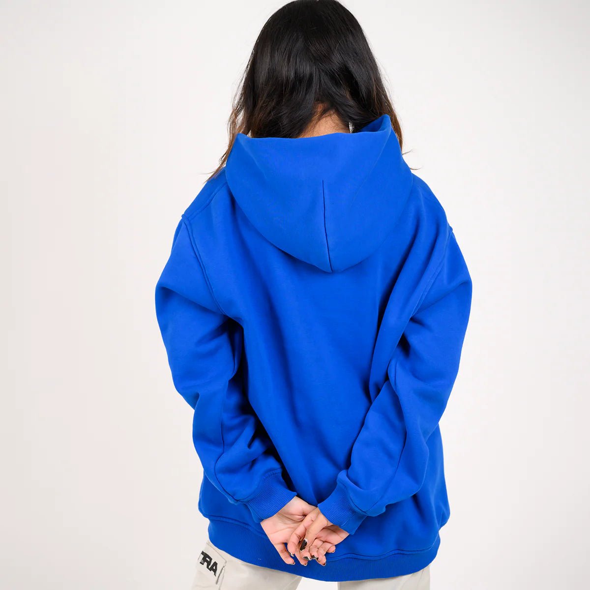 Blue pullover hoodie with hood, back view showing hem and sleeve cuffs