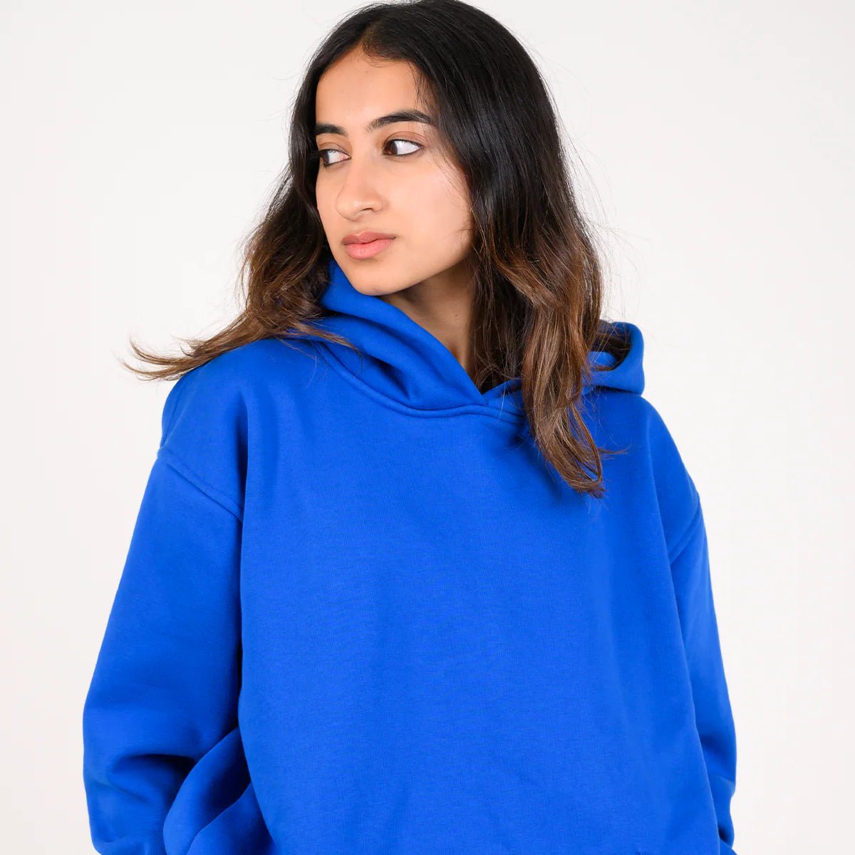 Blue pullover hoodie with hood, close-up of neckline and shoulder area