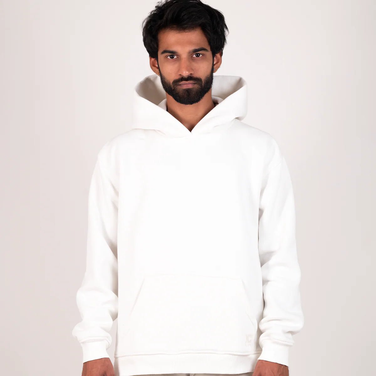 White pullover hoodie with hood and kangaroo pocket, front view centered.